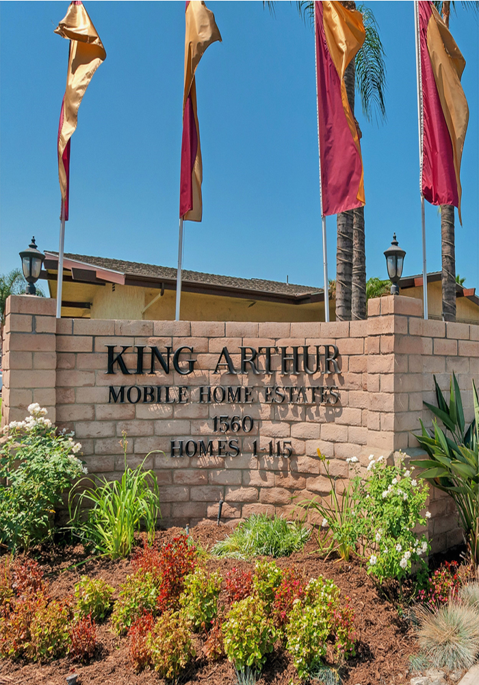flags flying above the King Arthur Estates sign